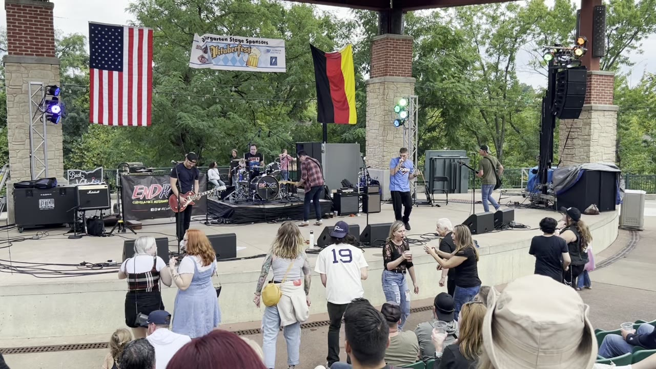 Fans dancing in front of the Oktoberfest amphitheater stage