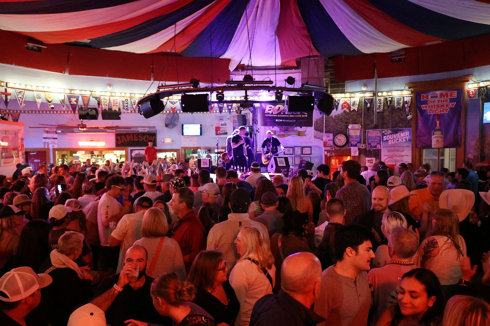 A packed room singing along in front of the EndRock stage