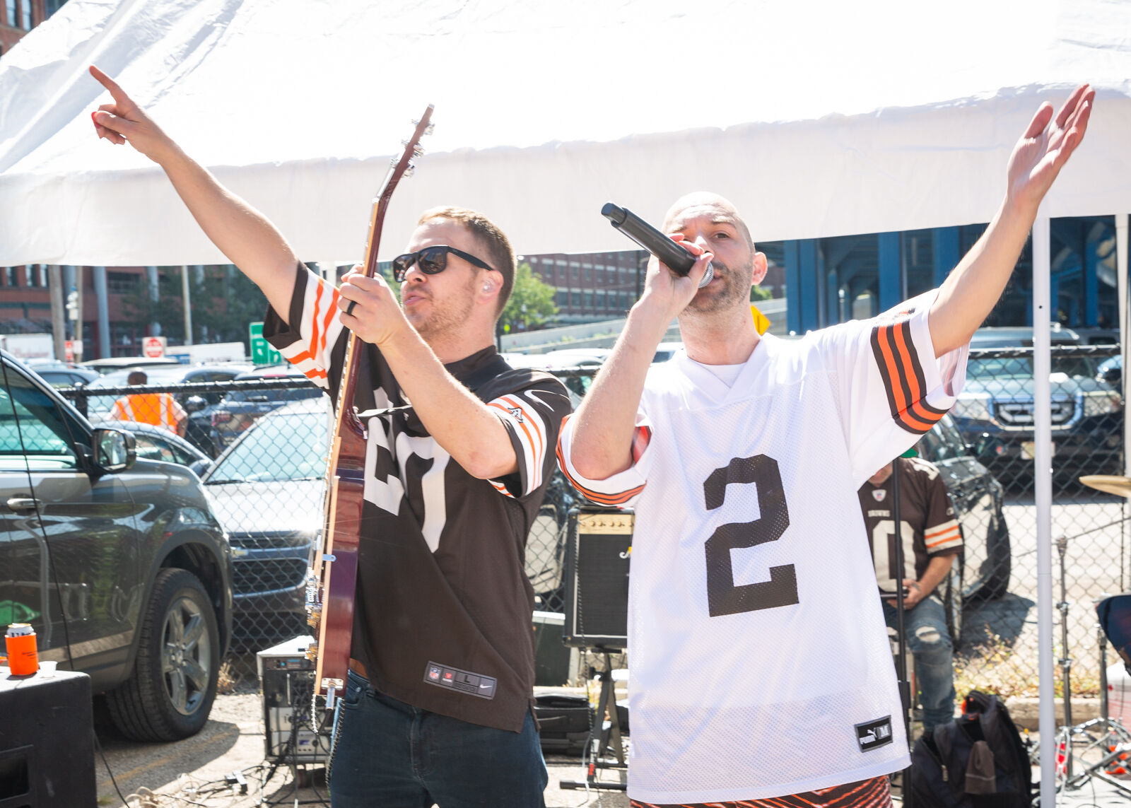 EndRock singer and guitarist in Browns jerseys throwing their arms up