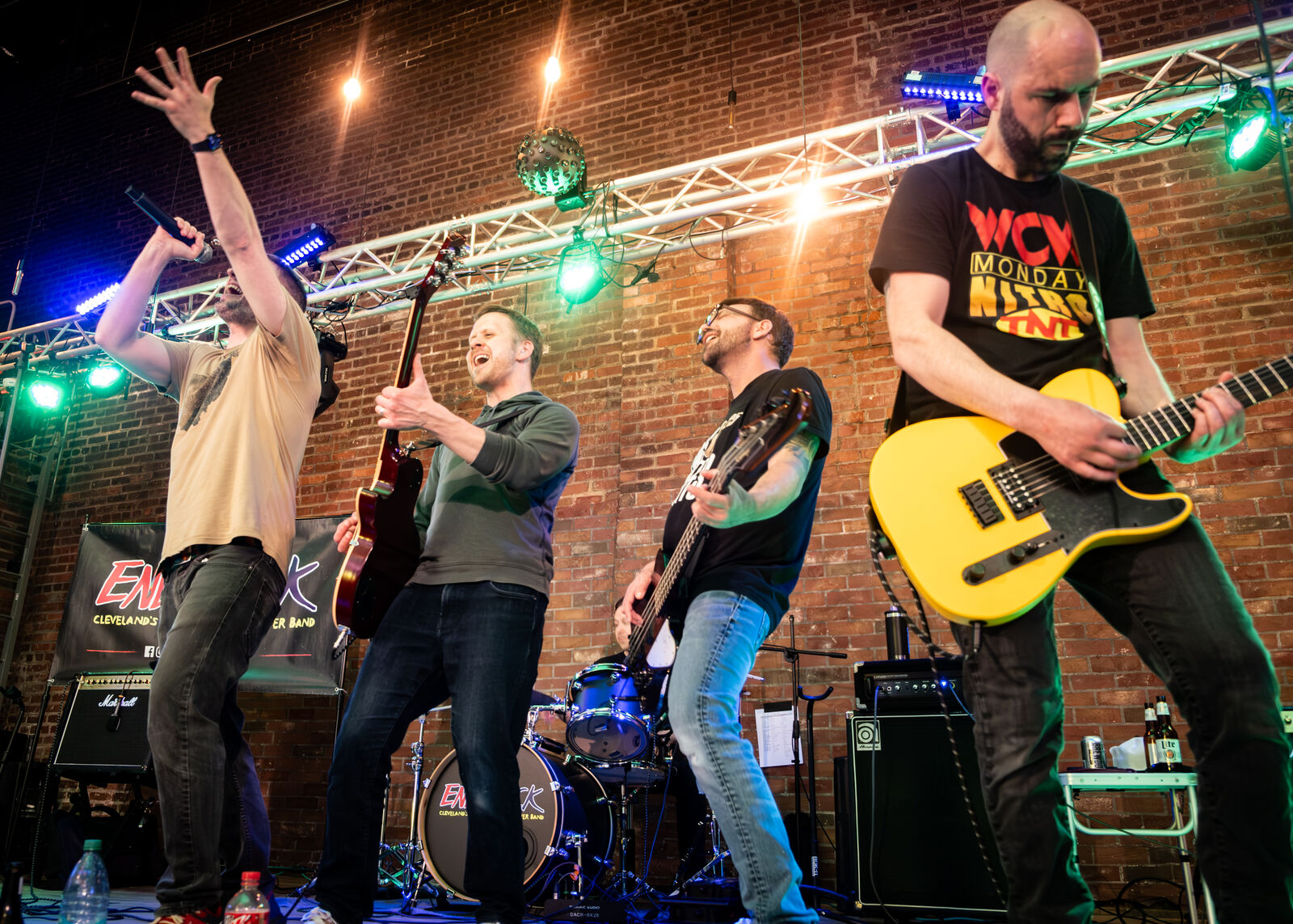 EndRock mid-jump on a brick-walled stage